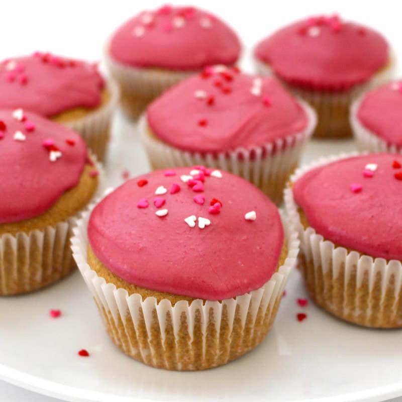 These super simple and festive Vegan Vanilla Cupcakes are perfect for Valentine's day! They are sugar-free, low-fat, oil-free with a gluten-free option. Also super low-calorie - only 95 calories each!